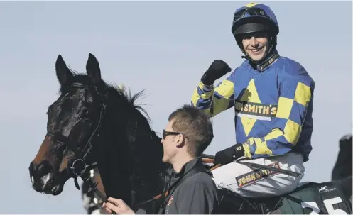  ??  ?? 0 Galashiels jockey Ryan Mania steered outsider Auroras Encore to glory in the 2013 Grand National at Aintree.