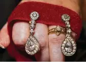  ??  ?? BLING: The earrings Grayson Carpenter wore in the Ms. Wheelchair Texas Pageant