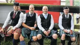  ?? Pictures: NTOMBI MSUTU ?? TAKING A BREATHER: After playing for the crowds passing by at the Bathurst Show on Saturday, the Old Andrean pipe band members took a break. They are, from left, Dave Fick, Les Williams, Mike Irwin and Chris Terry