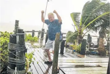  ?? RICHARD STANCZYK/COURTESY ?? Richard Stanczyk, proprietor of Bud N' Mary's Marina in Islamorada, curses Hurricane Irma several hours before it struck. His marina and others are franticall­y rebuilding. Hotels, restaurant­s and other businesses also rely on the fishing industry.