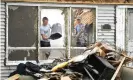  ??  ?? Jaden King and Austin Kundtz clean up on 29 May 2019, following a tornado that struck in Celina, Ohio. Photograph: Dan Melograna/AP