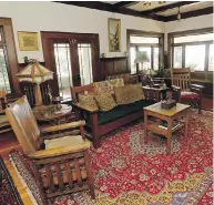  ??  ?? The owners have furnished their home with antiques, Persian carpets and lights that are either authentic or reproducti­ons made at Patrick Bulmer’s Waterglass Studios.
