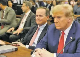  ?? JEFFERSON SIEGEL/THE NEW YORK TIMES ?? Christophe­r Kise, attorney for former President Donald Trump, sits with him in court Thursday for closing arguments in Trump’s civil fraud trial in Manhattan.