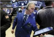  ?? RICHARD DREW — THE ASSOCIATED PRESS ?? Trader Timothy Nick works on the floor of the New York Stock Exchange Monday.