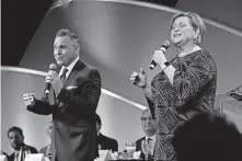  ?? [OKLAHOMAN ARCHIVES] ?? Don Peslis and his wife, gospel recording artist Sandi Patty, sing at the 2017 Metro Prayer Breakfast in downtown Oklahoma City.