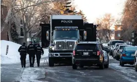  ?? ?? Police at the scene where two officers were shot and killed on duty in Edmonton, Alberta, Canada, on Thursday. Photograph: Canadian Press/Rex/Shuttersto­ck