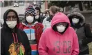  ?? Photograph: Morry Gash/Associated Press ?? Voters in Milwaukee wear masks against the coronaviru­s as they wait in line.