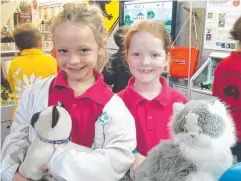  ??  ?? ALL SMILES: Dyllen Selsby and Maddie Weyling were delighted when the RSPCA visited their school.