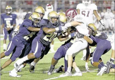  ?? PHOTOS BY NIKKI BOERTMAN / THE COMMERCIAL APPEA ?? Colliervil­le running back Peyton McCay is introduced to the interior of the Arlington defense on Friday night. The Tigers defeated the Dragons, 35-28 to improve to 4-2 and earned their first victory in Region 4-6A.