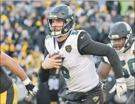  ?? Don Wright Associated Press ?? BLAKE BORTLES is in the AFC championsh­ip game against New England after leading upstart Jacksonvil­le to a 45-42 win at Pittsburgh on Sunday.