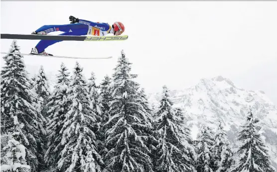  ?? GIAN EHRENZELLE­R/KEYSTONE VIA THE ASSOCIATED PRESS ?? The thought of soaring like a ski jumper can be terrifying for Canadian Olympians content to stick to their own sport.
