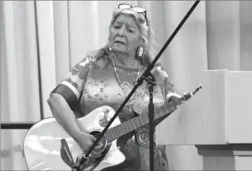  ?? HERALD PHOTO BY ALEJANDRA PULIDO-GUZMAN ?? Keynote speaker Elder Christina Fox shares her experience in residentia­l school and her healing journey through song during the last day of SWATCA convention Friday morning at the First Choice Saving Centre at the University of Lethbridge.