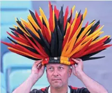  ?? — Reuters ?? A Belgian fan inside the stadium before the match.