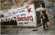  ?? Alvaro Barrientos / Associated Press ?? A wall reads “There is no barrier that will deny our country’s freedom” in Hernani, Spain, where ETA militants tried to create a Basque homeland.