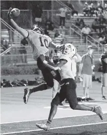  ?? ANDREW ULOZA FOR THE MIAMI HERALD ?? American Heritage wide receiver Oronde Gadsden (10) couldn’t come down with this pass, but the Patriots, inspired by DB Daemon Fagan’s huge plays, held on for a 7-3 win over Chaminade-Madonna on Friday.