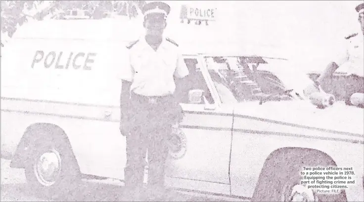  ?? Picture: FILE ?? Two police officers next to a police vehicle in 1978. Equipping the police is part of fighting crime and protecting citizens.