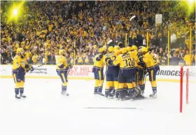  ?? Frederick Breedon / Getty Images ?? Nashville players celebrate after their victory over Anaheim earned them a Stanley Cup Finals berth. The Predators entered the playoffs with the fewest points among the 16 playoff qualifiers but are 12-4 in the postseason.