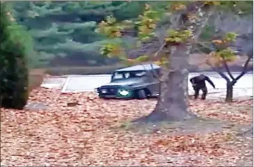  ?? NATIONS COMMAND/AFP UNITED ?? This screengrab made from video footage released by the United Nations Command on November 22 shows a North Korea defector running out from a vehicle at the Joint Security Area of the Demilitari­zed Zone.