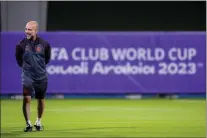  ?? MANU FERNANDEZ — THE ASSOCIATED PRESS ?? Manchester City’s head coach Pep Guardiola laughs during a training session at the King Abdullah Sports City Stadium in Jeddah, Saudi Arabia, Monday.