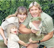  ??  ?? ‘Dad was the strongest person in my life’: Bindi Irwin, right, has worked hard to emulate her late father Steve Irwin, the Crocodile Hunter. Left, Bindi, then four, with mother Terri, wrestling with a toy croc held by Steve