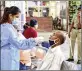  ??  ?? Healthcare worker collects swab samples of a passenger at CSMT. (Photo: Bhushan