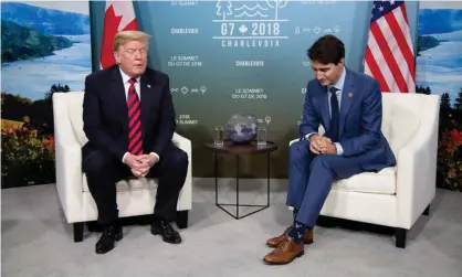  ?? Photograph: Christinne Muschi/Reuters ?? Justin Trudeau meets with Donald Trump at the G7 summit in Quebec. Trump’s trade advisor subsequent­ly said there was ‘a special place in hell’ for Trudeau.