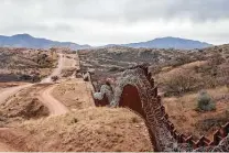  ?? Ariana Drehsler / Getty Images file ?? A view of the border fence, covered in concertina wire, separating the U.S. and Mexico, in the outskirts of Nogales, Ariz.