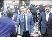  ?? JAMES NIELSEN / HOUSTON CHRONICLE ?? David Daleiden (center) greets supporters outside the courthouse in Houston on Tuesday after prosecutor­s dropped charges against him and another anti-abortion activist, Sandra Merritt, who had been indicted by a grand jury.