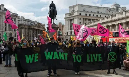  ?? Photograph: Barcroft Media/Getty Images ?? Activists from Extinction Rebellion gather outside the Bank of England in a central London protest last month.