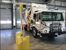  ?? ?? Refueling happens overnight. Trucks are connected to refueling posts at the end of work shifts and are ready to go in the morning.