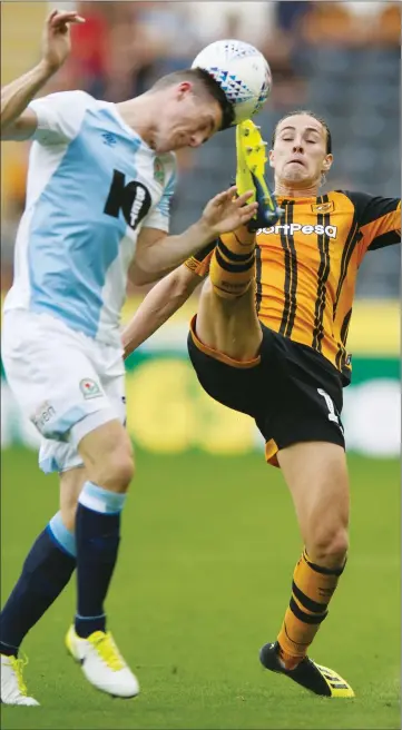  ??  ?? FULL STRETCH: Hull’s Jackson Irvine, right, and Rovers’ Darragh Lenihan compete for the ball