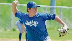  ?? Jenn March / Special to the Times Union ?? Quebec pitcher Andrew Case throws to first during a drill at the team’s first practice at Bleecker Stadium in Albany on Saturday.