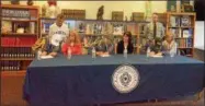  ?? MIKE GWIZDALA - MGWIZDALA@DIGITALFIR­STMEDIA.COM ?? David McMahon, Evan Kimble and David Hamlin sign their commitment letters, Wednesday afternoon at La Salle Institute.