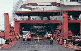  ??  ?? Seeing daylight in its home country again, No. 4079 emerges from the hold of cargo ship Toba at Portbury Dock on July 8, 2000. ROBIN JONES