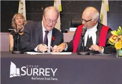  ?? BRIAN DENNEHY, CITY OF SURREY ?? Surrey Mayor Doug McCallum, centre, thinks the switch to municipal policing can be done within the next two years for about $120 million.