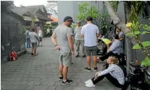  ?? FAIRFAX ?? A media scrum forms outside Schapelle Corby’s house in Denpassar, Bali before her departure for Australia.