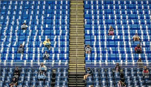  ?? Andrew Rush/Post-Gazette ?? Students attend professor Peggy Van Meter’s education class Oct. 8 in the 16,000-seat Bryce Jordan Center at Penn State University in State College.