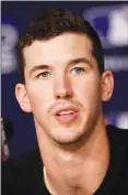  ??  ?? Los Angeles Dodgers starting pitcher Walker Buehler speaks during a baseball news conference, Thursday, in Los Angeles, ahead of today’s Game 3 of the World Series against the Red Sox.