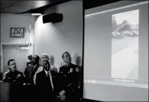  ?? ASSOCIATED PRESS ?? AUTHORITIE­S WATCH A VIDEO of the shooting scene at a news conference on Friday in El Cajon, Calif., held to address the killing of Alfred Olango, a Ugandan refugee shot by an El Cajon police officer on Tuesday. The El Cajon police department released...