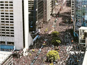  ?? ANDREW LAHODYNSKY­J/AP ?? The Raptors’ parade in Toronto drew more than a million people before gunfire broke out at the rally afterward.