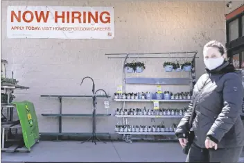  ?? NAM Y. HUH ?? A HIRING SIGN IS seen outside home improvemen­t store in Mount Prospect, Ill., Friday, April 2, 2021. The pace of job openings reached the highest level on record in February, a harbinger of healthy hiring and a hopeful sign for those looking for work.