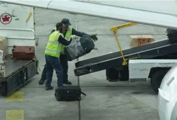  ?? KEN FAUGHT/TORONTO STAR FILE PHOTO ?? Aviation industry workers could benefit from the NDP’s minimum wage pledge, says a Brock University professor.