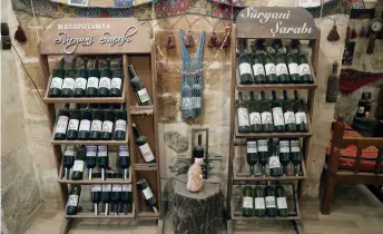  ?? ?? This photograph shows bottles of Assyrian wine in a wine store in Mardin, southeaste­rn Turkey.