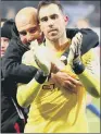  ??  ?? WELL DONE: Manchester City manager Pep Guardiola hugs goalkeeper Claudio Bravo.