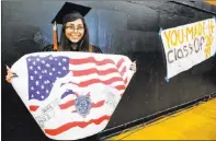  ?? Chase Stevens Las Vegas Review-journal ?? Cassandra Sosa shows her winning mural design atagraduat­ion ceremony rehearsal at Chaparral
High School on Thursday. Sosa won an art contest held by Cicis Pizza to commemorat­e the two fallen Las Vegas police officers.