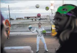  ?? Erik Verduzco ?? Las Vegas Review-journal @Erik_verduzco Josue Rodriguez, a juggler for Circo Hermanos Ramos, performs Tuesday during the Mardi Gras celebratio­n at the historic Harrison House in Las Vegas.