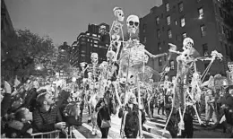  ?? FRANK FRANKLIN II/AP ?? Revelers march last year during the Greenwich Village Halloween Parade in New York.