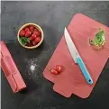  ?? ?? Rollable chopping board in coral, £22, A Place for Everything