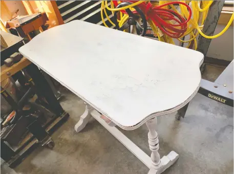  ?? PHOTOS: STEVE MAxwELL ?? This 100-year-old table had a badly deteriorat­ing dark finish that was mottled and flaking. Rather than strip it to bare wood, I completed a light sanding followed by chalked
paint and distressin­g.