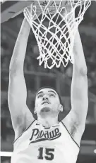  ?? JOE TIMMERMAN/INDIANAPOL­IS STAR ?? Purdue center Zach Edey dunks against Utah State on Sunday in an NCAA Tournament game.